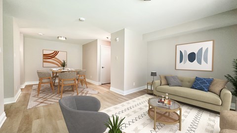 a living room with a couch and a dining room table